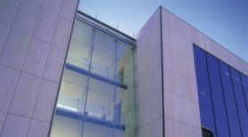 View from below of the facade of a modern glass building